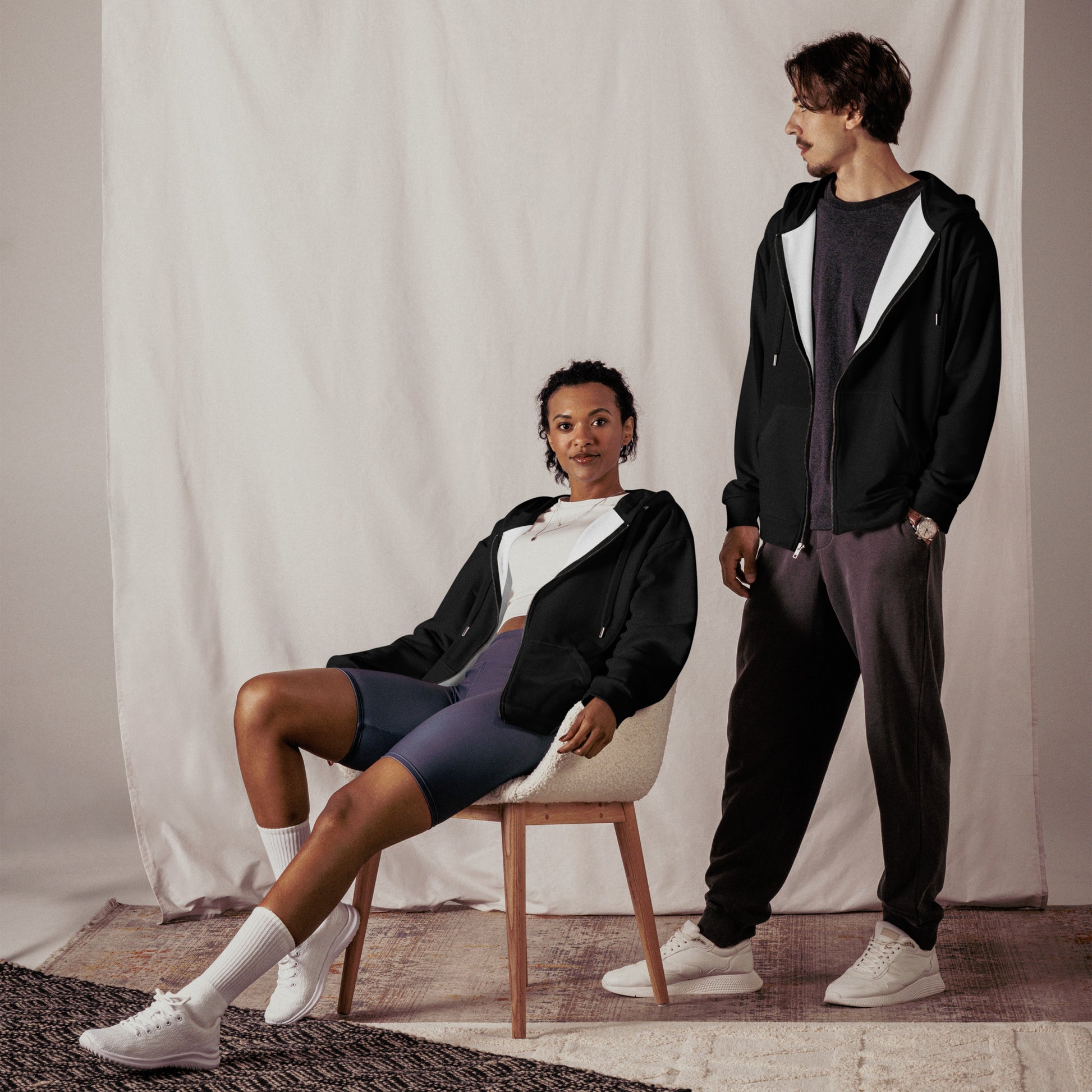 Purpose Unisex Zip Hoodie von Research Merch getragen von einem jungen Pärchen